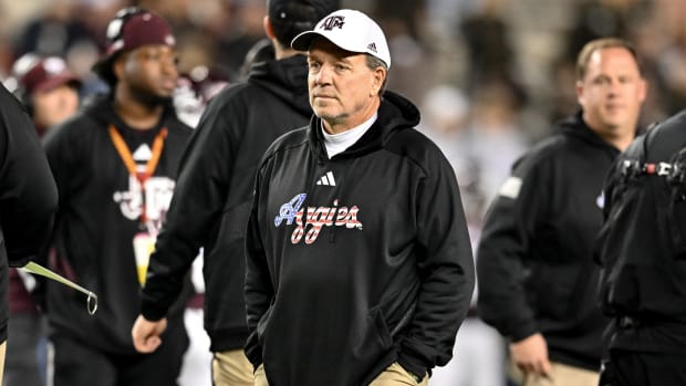 Texas A&M football coach Jimbo Fisher looks on during warm ups before a game against Mississippi State.